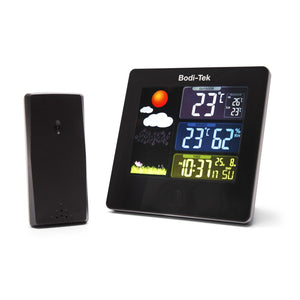 The Digital Weather Station features a colorful display with weather icons, indoor/outdoor temperature, humidity, and time readings. A black wireless sensor is next to the unit, while the screen shows a sunny icon and numerical data.