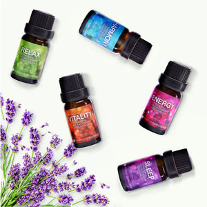 The Rio Wellbeing Collection Aromatherapy Essential Oils—Relax, Harmony, Vitality, Energy, and Sleep—are arranged in a circle on white with fresh lavender below, ideal for creating your personalized essential oil set.