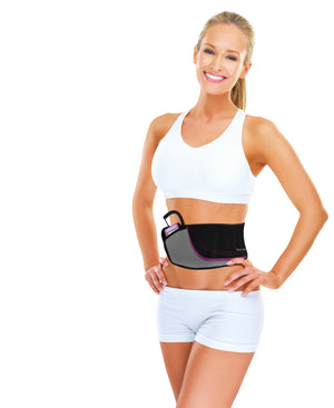 A smiling woman in a white sports bra and shorts models the Ab Toning, Exercising & Firming Belt—black and gray, designed to target abdominal muscles—standing with one hand on her hip against a plain white background.