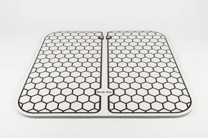 The Circulation Plus Boost & Revive Mat, a rectangular muscle stimulator with a honeycomb pattern and Bodi-Tek branding at the bottom center, is placed on a white background.