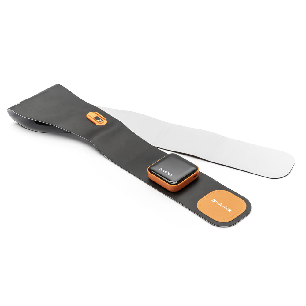 A black and orange Ab & Back Muscle Strengthener with heat, featuring an attached control unit and gel pads, is laid flat on a white background.