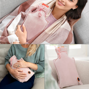 A collage shows two women holding a Cozy UNA Rechargeable Hot Water Bottle in soft, light pink, with a close-up of the bottle on a couch. Both women look relaxed and cozy, wrapped in warm clothing or blankets.