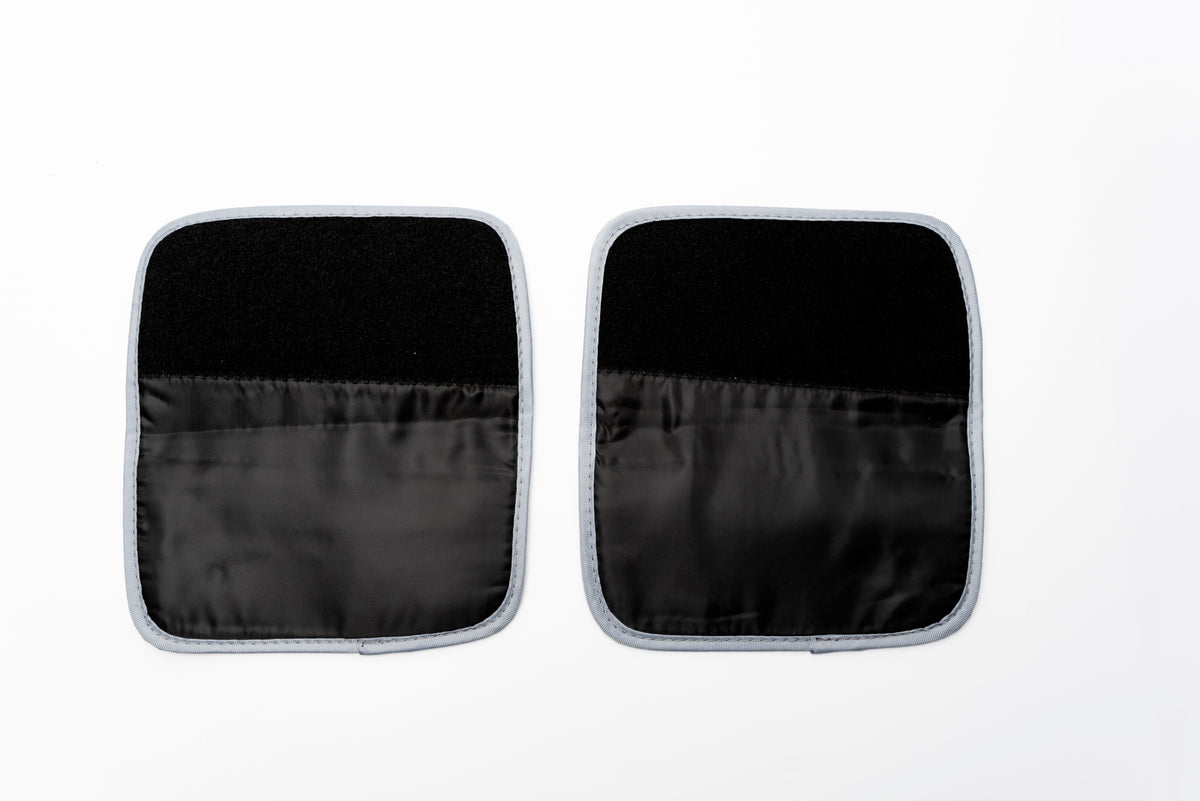 The COMFORT360° Air Compression Massager Boot Extension Straps are black and white cloth pads, ideal for extending the fit of your massager boots.