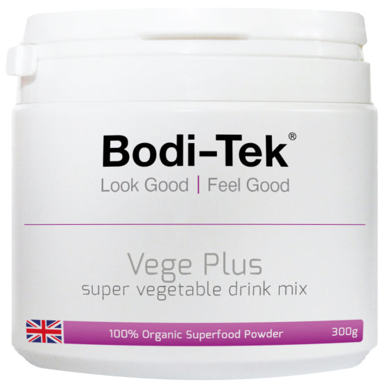 A white container labeled GreeNourish Complete organic superfood powder, with a British flag and text 100% Organic Superfood Powder and Look Good | Feel Good. This 300g green shake is an ideal meal replacement option.