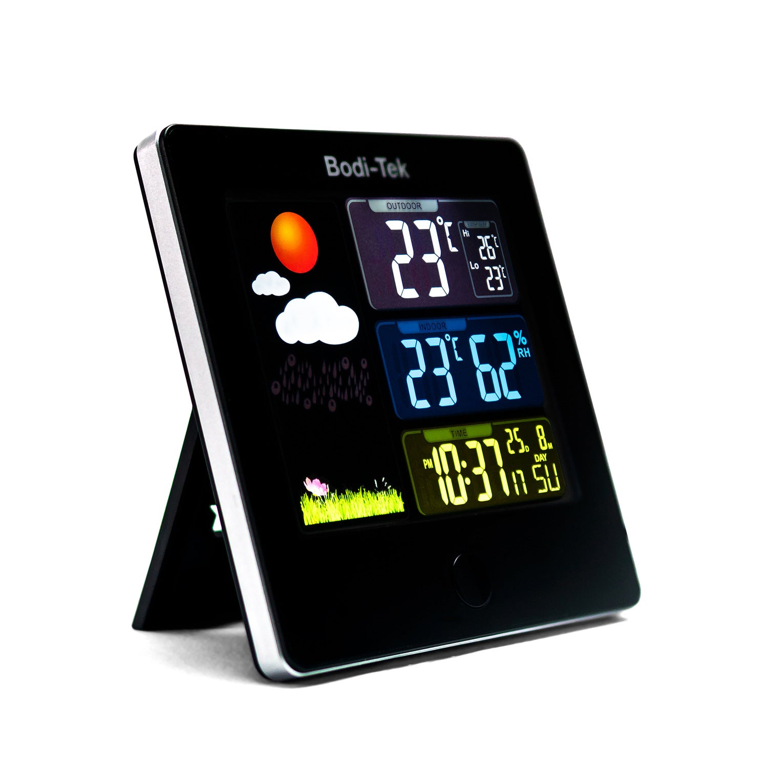 The Digital Weather Station features a sleek black frame with a fold-out stand, displaying indoor/outdoor temperature, humidity, time, date, and colorful weather icons like sun, clouds, and grass on its vibrant digital screen.