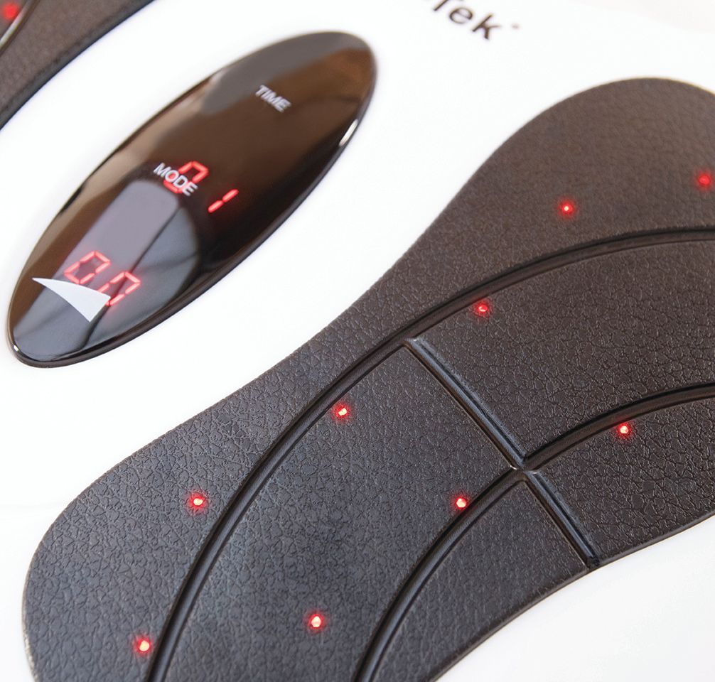 Close-up of the Circulation Plus Active Lower Leg & Foot Exerciser (2025), featuring a textured black surface, red LED lights, and a display screen with numbers and settings visible.