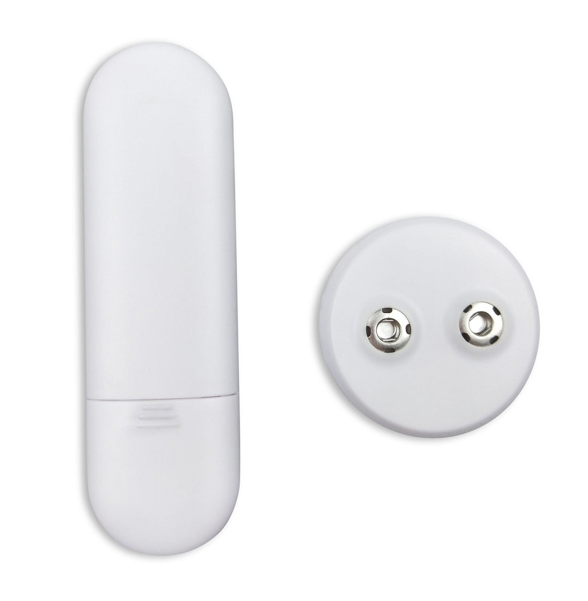 The Circulation Plus Boost & Revive Mat, a white oval electronic device with a removable cap and a round battery compartment showing two metal contacts, is displayed on a plain white background.